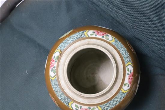 A pair of Chinese export Batavia ware famille rose jars, 18th century, H. 21cm, wood covers and stands